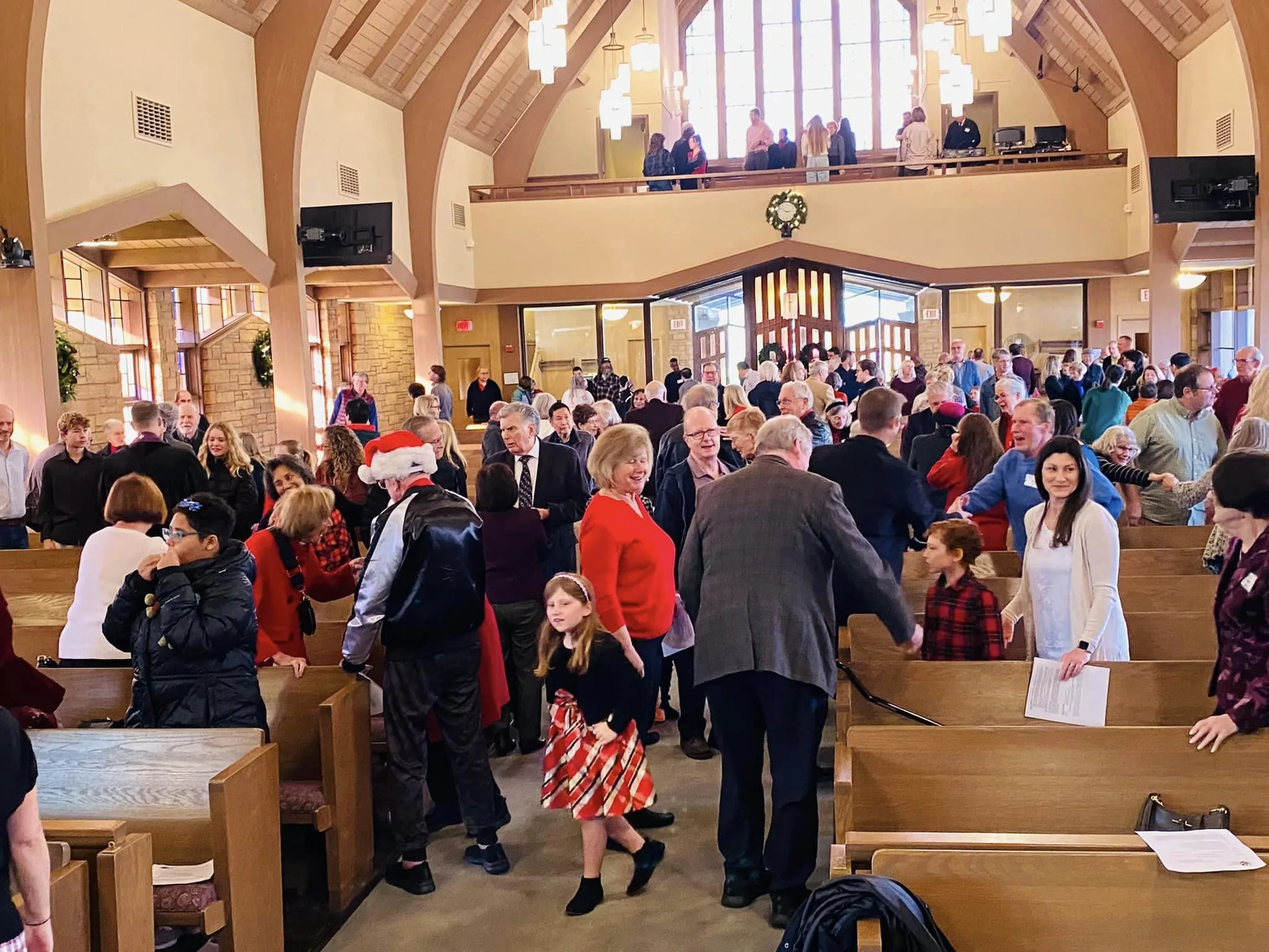 The PCLG congregation greeting one another in the Sanctuary after worship.