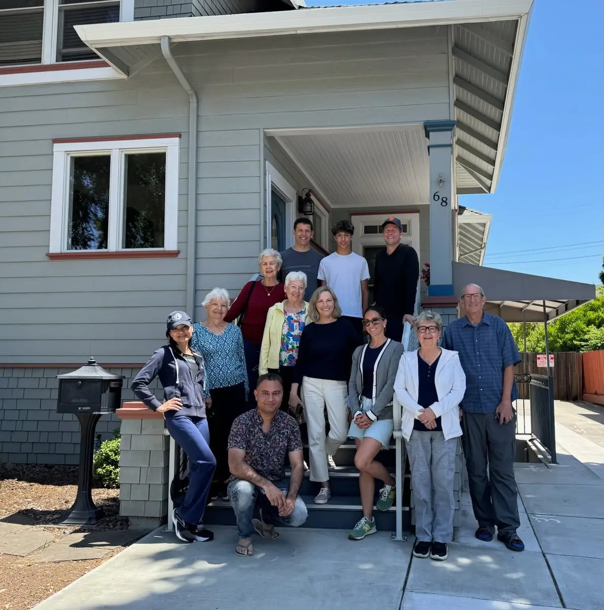 A PCLG group gathered on the front steps and porch of Immanuel House.