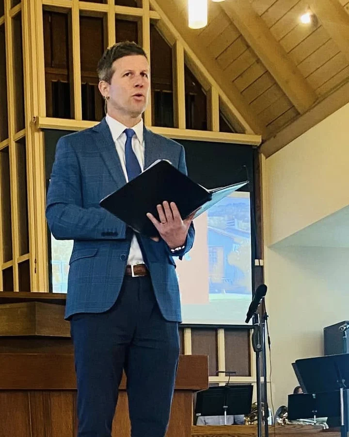 The Rev. Dr. David G. Watermulder leading worship in the Sanctuary.